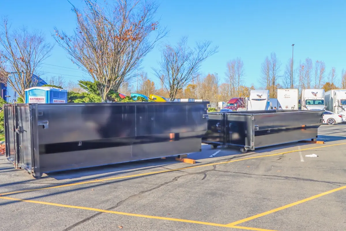 Professional dumpster rental service with roll-off container on residential driveway in Grapevine